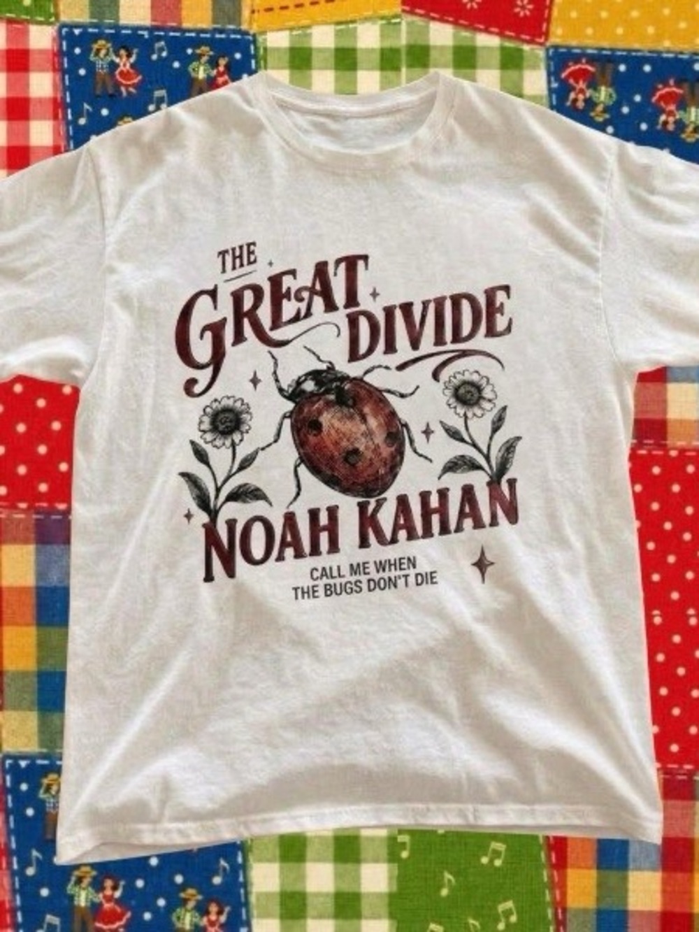 Noah Kahan with red ladybug graphic and white floral